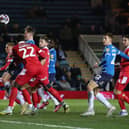 Frankie Kent of Peterborough United heads in the winning goal against Shrewsbury Town in February. Photo: Joe Dent/theposh.com.