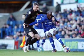 Jack Taylor of Peterborough United battles with Sone Aluko of Ipswich Town. Photo: Joe Dent.