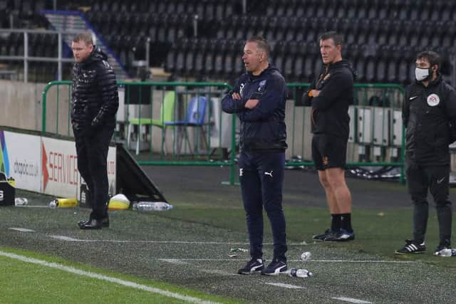 Rival managers Grant McCann (left) and Darren Ferguson. Photo: Joe Dent/theposh.com