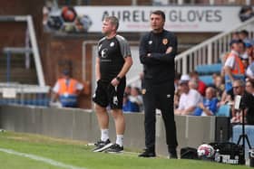 Manager Grant McCann alongside Hull City Manager Shorta Arveladze. Photo: Joe Dent.
