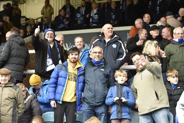 Peterborough United fans watch as their side slip to defeat against Blackpool.