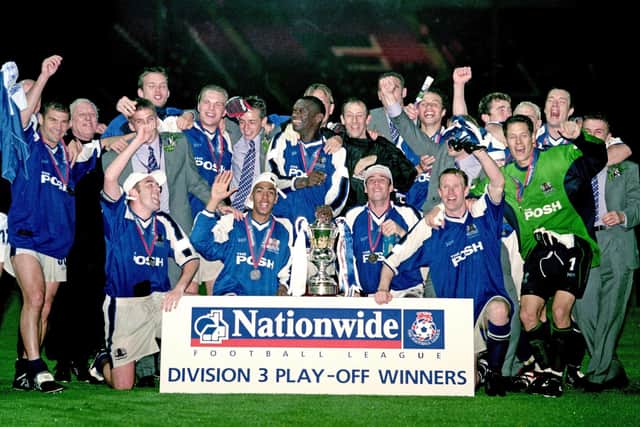 Peterborough United celebrate after winning the Division Three play off final at Wembley in 2000.