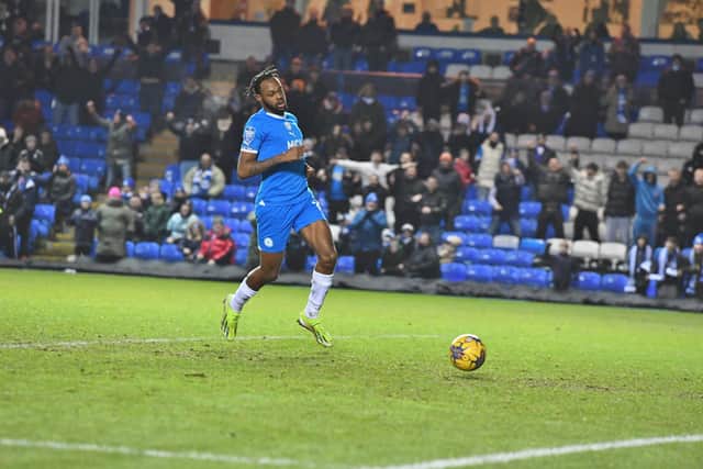 Ricky-Jade Jones walks the ball into an empty met to secure a 3-1 EFL Trophy win against Wimbledon. Photo: David Lowndes.