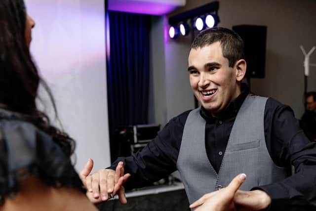 Liza enjoys a dance with Spencer at the Rainbow Ball. Photo: Dan Waters Creative Photography