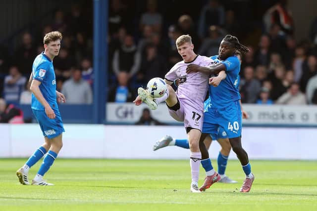 Jacob Mendy (right) in action for Posh against Lincoln City earlier this month. Photo Joe Dent/theposh.com. Photo Joe Dent/theposh.com