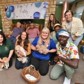 Michelle Daughtrey and staff from her Animal Therapy Petting Party visiting residents at the dementia unit at Castor Lodge Care Home, which was celebrating its first birthday.