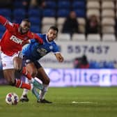 Nathan Thompson of Peterborough United in action with Corey Blackett-Taylor of Charlton Athletic. Photo: Joe Dent/theposh.com.