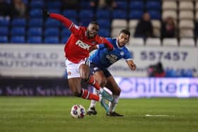 Nathan Thompson of Peterborough United in action with Corey Blackett-Taylor of Charlton Athletic. Photo: Joe Dent/theposh.com.