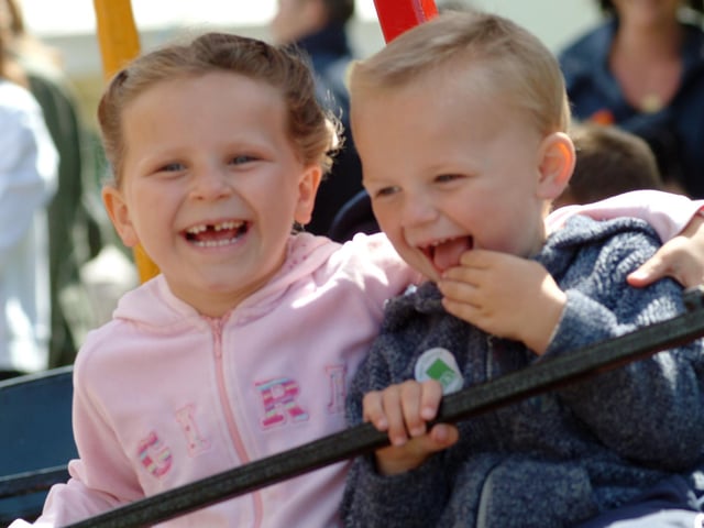 Chloe Green, 5, and her 3 year old brother Alex  enjoying the rides.