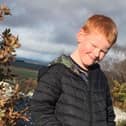 Finn Hollis, 8, is raising money for Cancer Research UK by tackling a gruelling 3km long muddy obstacle course on June 25.