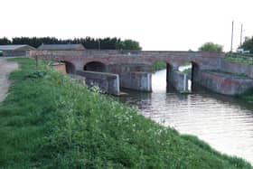 The double bridge at Parson's Drove joins Cambridgeshire to Lincolnshire. At this point the North Level Main Drain splits into two. The structure, which acts as both a bridge and a sluice, was built in the 1830s for drainage purposes. It was listed by Historic England in 1983.