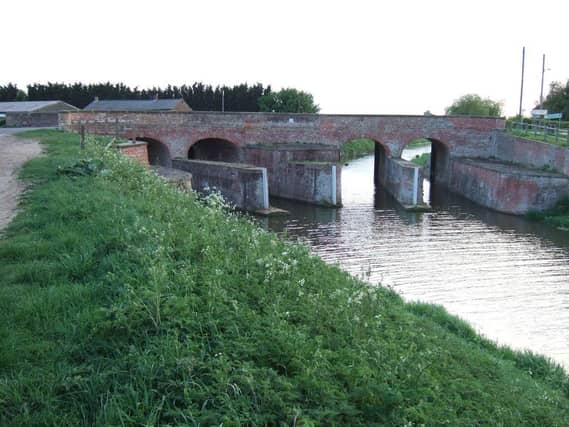 The double bridge at Parson's Drove joins Cambridgeshire to Lincolnshire. At this point the North Level Main Drain splits into two. The structure, which acts as both a bridge and a sluice, was built in the 1830s for drainage purposes. It was listed by Historic England in 1983.
