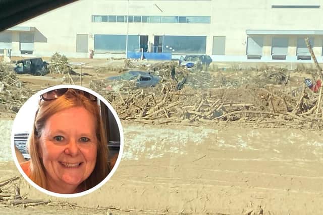 Diana Whitwell (inset) and a photos the family took from their car of vehicles swallowed by mud and debris along roads in Valencia, Spain.