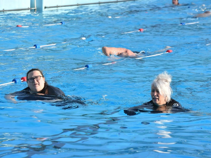 Swimmers enjoy some morning sun.