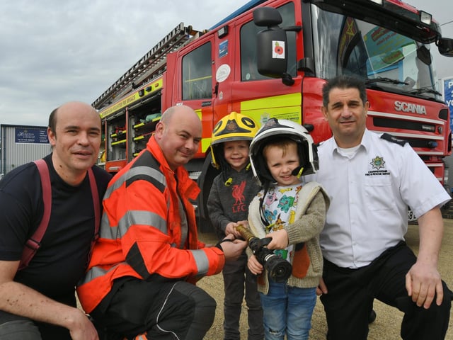 Opening of the Inspired Playtown at Hampton. Peterborough Volunteer firefighters Kevin Duke, Nick Cowley and watch commander Anthony Gould with four-year-olds Arthur Preston and Boden Thompson