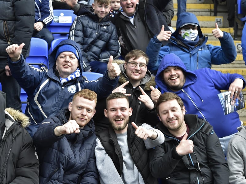 Peterborough United fans are pictured watching the crucial win over Derby County.