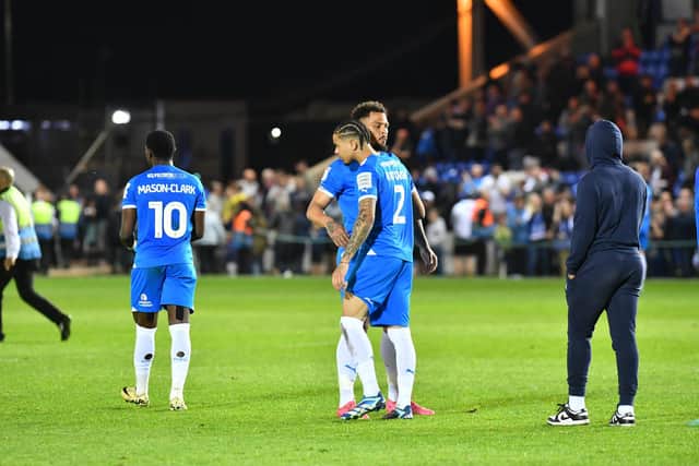 Jonson Clarke-Harris consoles Jadel Katongo after the Posh play-off defeat at the hands of Oxford United. Photo David Lowndes.