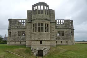 Lyveden New Bield, located in Northamptonshire, is an unfinished Elizabethan summer house and moated garden commissioned by Sir Thomas Tresham in the late 16th century. It was abandoned in 1605 after Tresham's death. The house has remained unfinished for more than 400 years and is now managed by the National Trust.