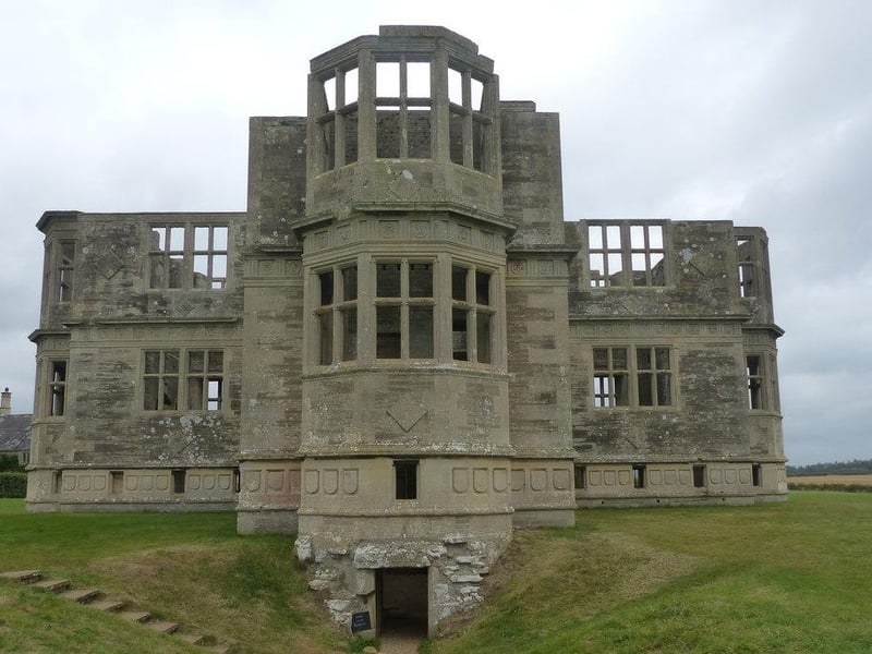Lyveden New Bield, located in Northamptonshire, is an unfinished Elizabethan summer house and moated garden commissioned by Sir Thomas Tresham in the late 16th century. It was abandoned in 1605 after Tresham's death. The house has remained unfinished for more than 400 years and is now managed by the National Trust.