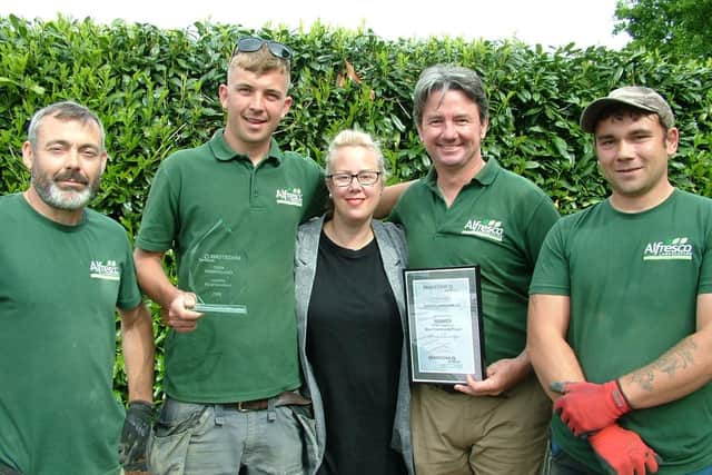 The Alfresco Landscaping team receive their award from Sarah Hennem of Bradstone.
