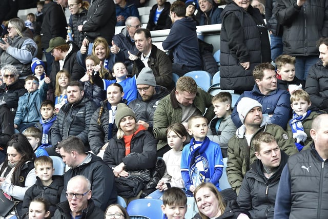 Peterborough United fans watch as their side slip to defeat against Blackpool.