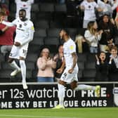 Mo Eisa celebrates an MK Dons goal. Photo by Pete Norton/Getty Images.