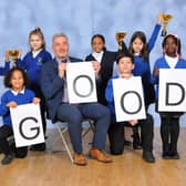 Headteacher Will Fisk and pupils at the Beeches Primary School celebrate their Good Ofsted rating.