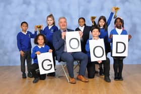 Headteacher Will Fisk and pupils at the Beeches Primary School celebrate their Good Ofsted rating.