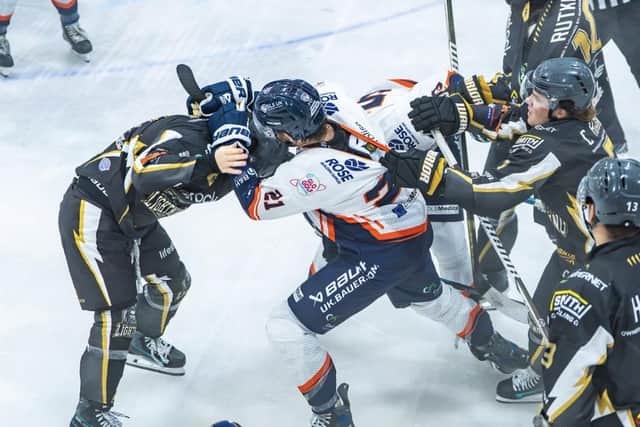 Adam Berg of Phantoms (white) tussles with Harry Gulliver of MK Lightning. Photo Willow Florence Photography
