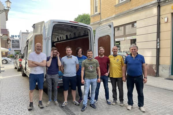 After a 1,700-mile journey, the team unloads a van of food and essentials in Gliwice, Poland.