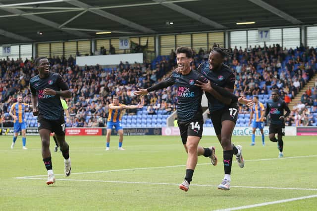 Joel Randall celebrates the third Posh goal at Shrewsbury with Ricky-Jade Jones (right) and Kwame Poku (left). Photo Joe Dent/theposh.com.