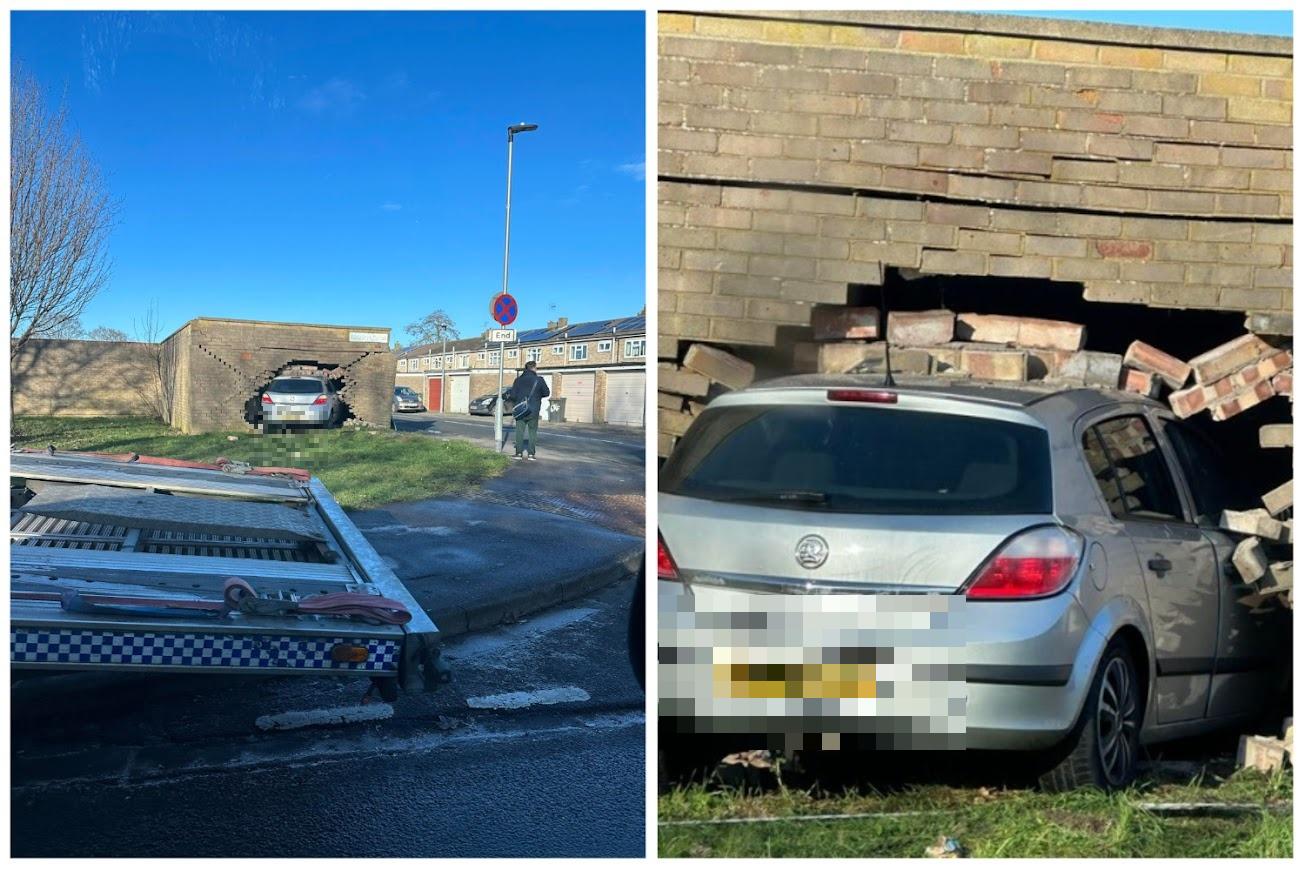 Car leaves giant hole in brick wall after driver crashes into garages ...