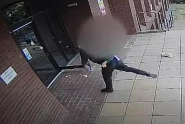 A still from the CCTV footage as mayonnaise is launched at the court doors