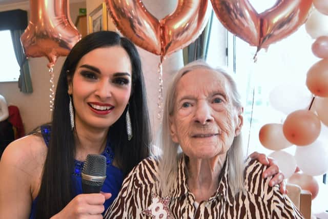 100-year-old Iris Taylor celebrates her birthday at Hampton Grove Care Home with singer Gabriella