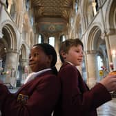 Cathedral junior choristers Muthoni and Theo with their Christingles.