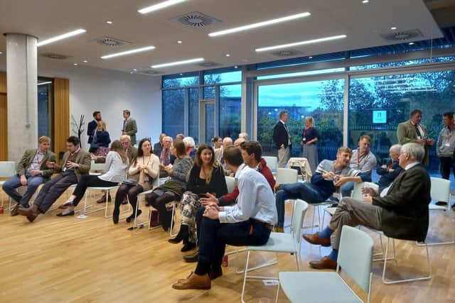 Launch event attendees discuss Scholars Programme opportunities