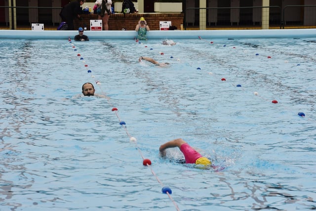 Swimmers attending the first session of the Lido season.
