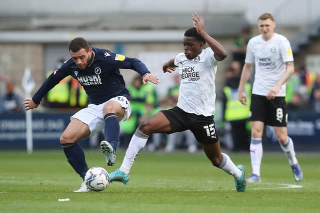 Kwame Poku (white shirt) in action for Posh.