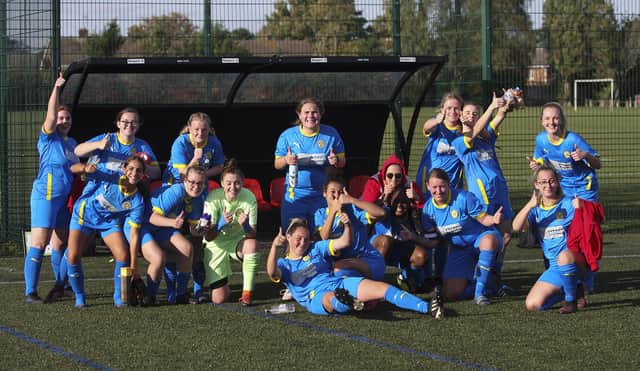 Peterborough Sports Ladies celebrate their Cambs Womens League Cup success at Netherton United. Codie Steward is at the front. Photo: Tim Symonds.