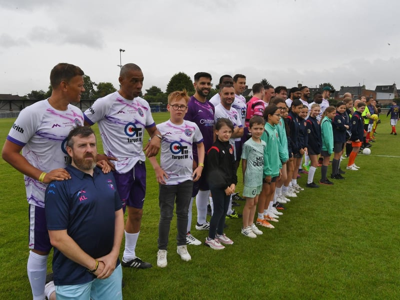 The Celebrity XI line-up on the pitch.