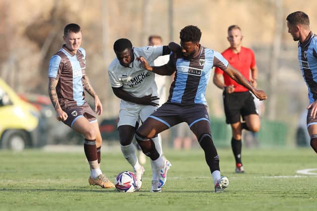 Kwame Poku (left) in action for Posh against AFC Wimbledon. Photo Joe Dent/theposh.com.