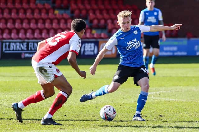 Louis Reed in action for Posh.