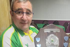Winning captain Ally McNaughton with the Cliff Watson Memorial Shield.
