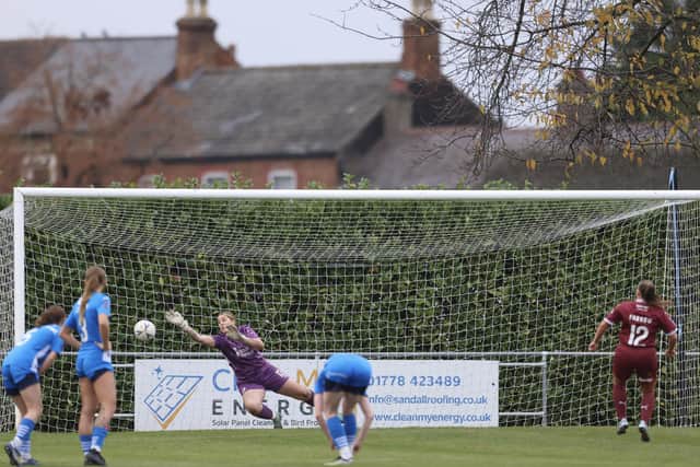 Posh goalkeeper Neive Corry saves a Northampton penalty. Photo Darren Wiles