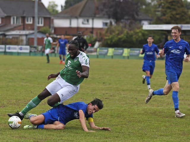 FC Peterborough (green) in action.