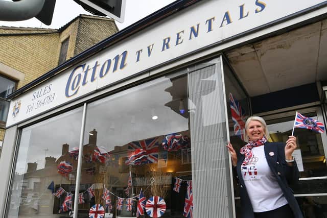 Hayley Cotton-Shelton at Cotton's TV shop at Oundle Road with their Jubilee window display last year. Sadly the shop has now been forced to close