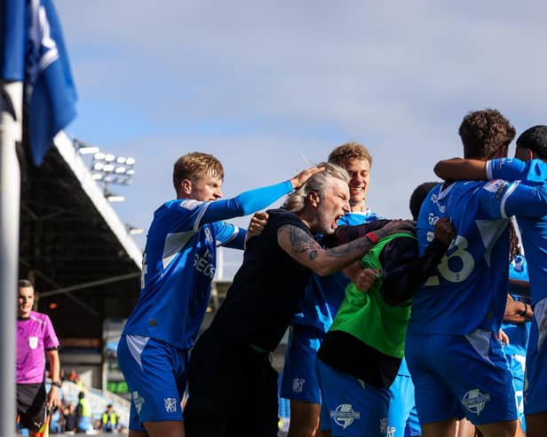 Posh boss Robbie Savage joins in the celebrations after Matt Garbett's last-gasp equaliser against Burton Albion. Photo Joe Dent/theposh.com