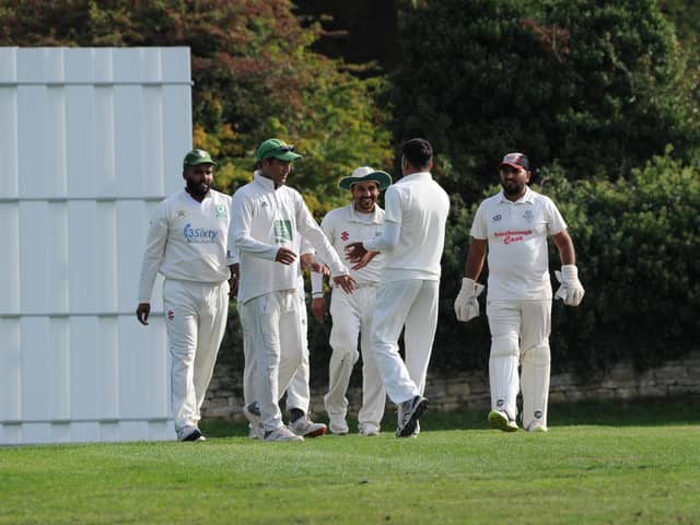 Barnack players celebrate a wicket in their 25-run win over Peterborough Town last weekend.