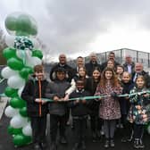 Official opening of the new A47  pedestrian bridge, which links Netherton with South Bretton.  Ravensthorpe primary pupils with Wayne Fitzgerald and bridge officials at the ribbon cutting