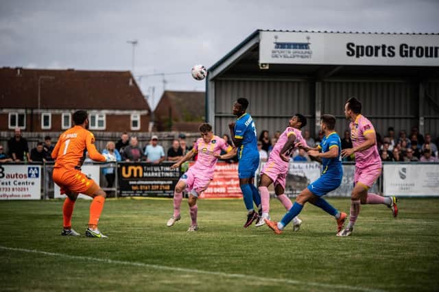 Dion Sembie-Ferris heads in the equaliser for Peterborough Sports in the second half. Photo: James Richardson.